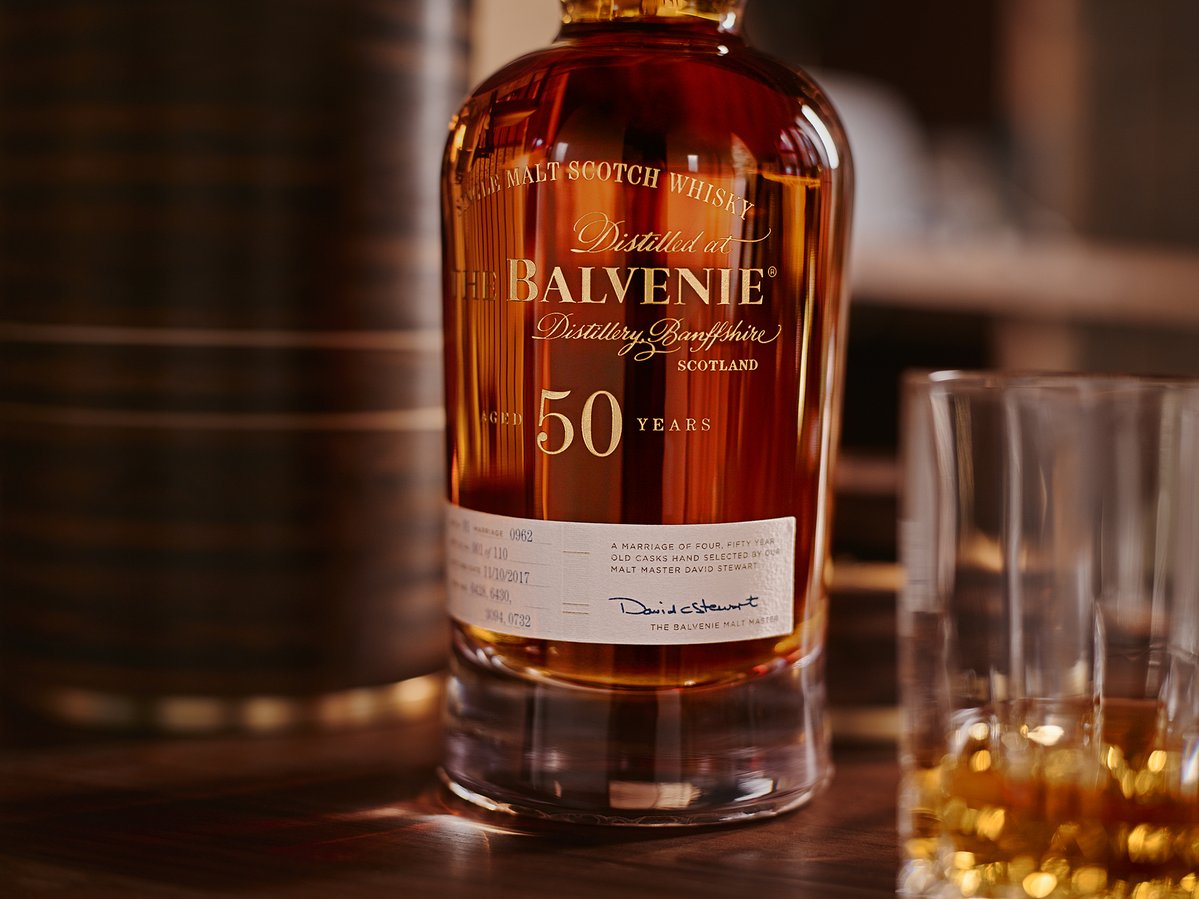 The Balvenie Fifty next to glass and custom bottle holder