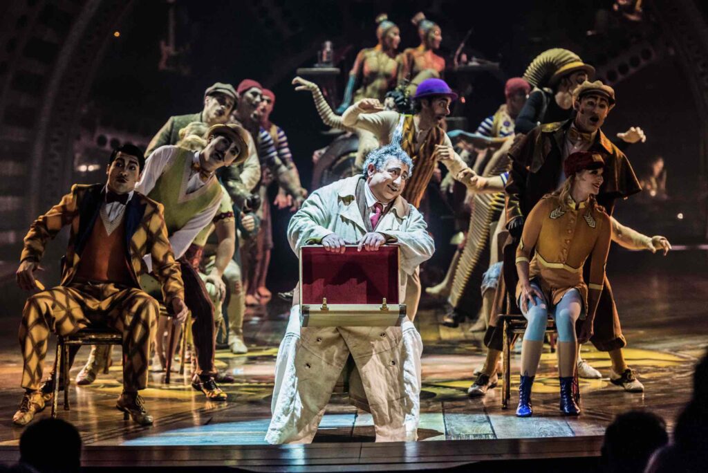 Cirque du Soleil’s KURIOS man with suitcase and full cast