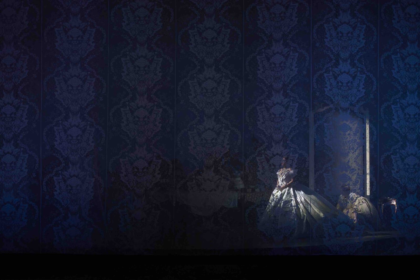 Traviata actress behind lace curtain